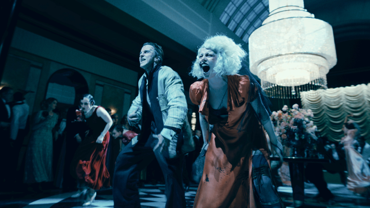 (L to R) Christian Bale as Frank and Jessie Buckley as The Bride in Warner Bros. Pictures 'The Bride!', a Warner Bros. Pictures release. Photo Credit: Courtesy of Warner Bros. Pictures. Copyright: © 2026 Warner Bros. Entertainment Inc. All rights reserved.