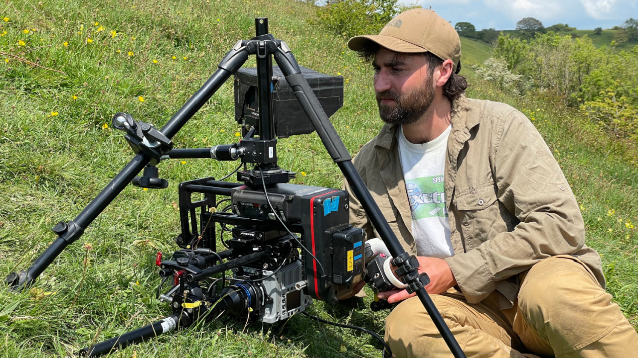 Cinematographer Owen Carter filming the broomstick bee (Osmia bicolor) sequence in 'Secrets of Bees'. Photo credit: National Geographic/Nadege Laici.