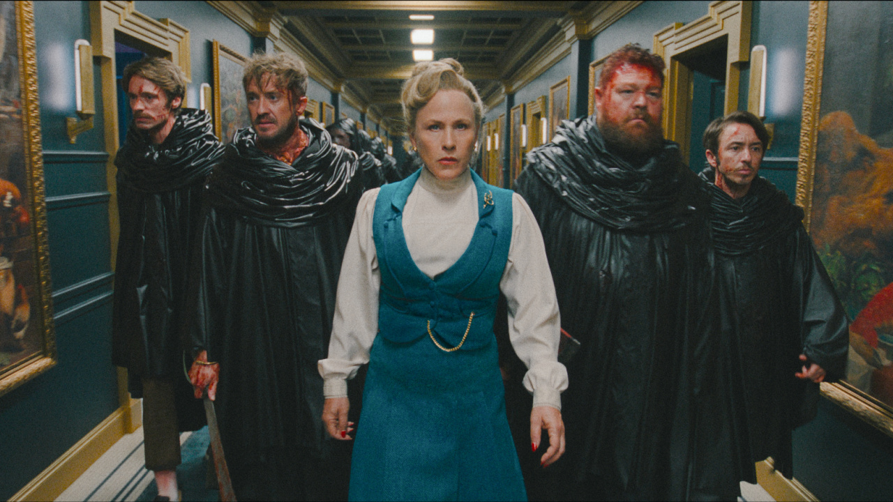 (L to R) David Viviers as Tall Steve, Tom Felton as Kevin, Patricia Arquette as Lily Woodhouse, Willie Ludik as Bob, and Gabe Gabriel as Small Steve in New Line Cinema/Nocturna’s 'They Will Kill You', a Warner Bros. Pictures release. Photo Credit: Courtesy Warner Bros. Pictures. Copyright: © 2026 Warner Bros. Entertainment Inc. All Rights Reserved.