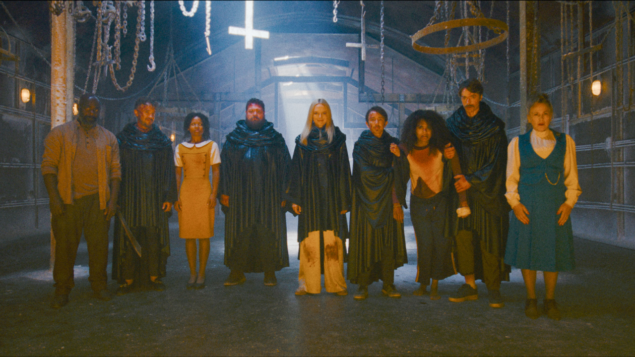 (L to R) Paterson Joseph as RAY, Tom Felton as Kevin, Myha'la as Maria, Willie Ludkin as Bob, Heather Graham as Sharon, Gabe Gabriel as Small Steve, Zazie Beetz as Asia, David Vivers as Tall Steve, and Patricia Arquette as Lily Woodhouse in New Line Cinema/Nocturna’s 'They Will Kill You', a Warner Bros. Pictures release. Photo Credit: Courtesy Warner Bros. Pictures. Copyright: © 2026 Warner Bros. Entertainment Inc. All Rights Reserved.